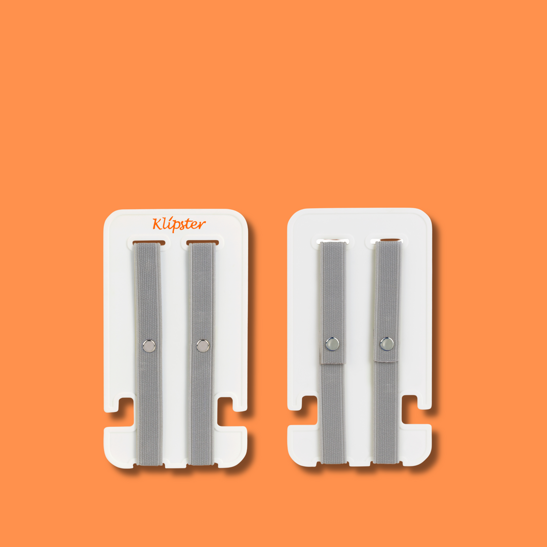 Mini Klipster hair accessories organizer next to an iPhone for size reference. Compact, portable storage for clips, scrunchies, and hair ties.