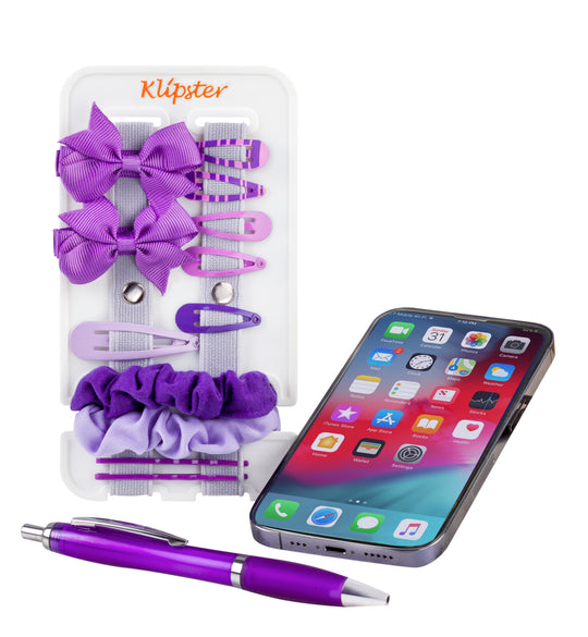 Mini Klipster hair accessories organizer next to an iPhone for size reference. Compact, portable storage for clips, scrunchies, and hair ties.