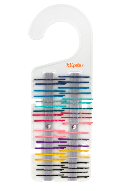Multi-colored bobby pins on the Classic Klipster hair accessories organizer. Double-sided, lightweight, and compact way to store hair clips, hair bows, scrunchies, hair ties, and more.