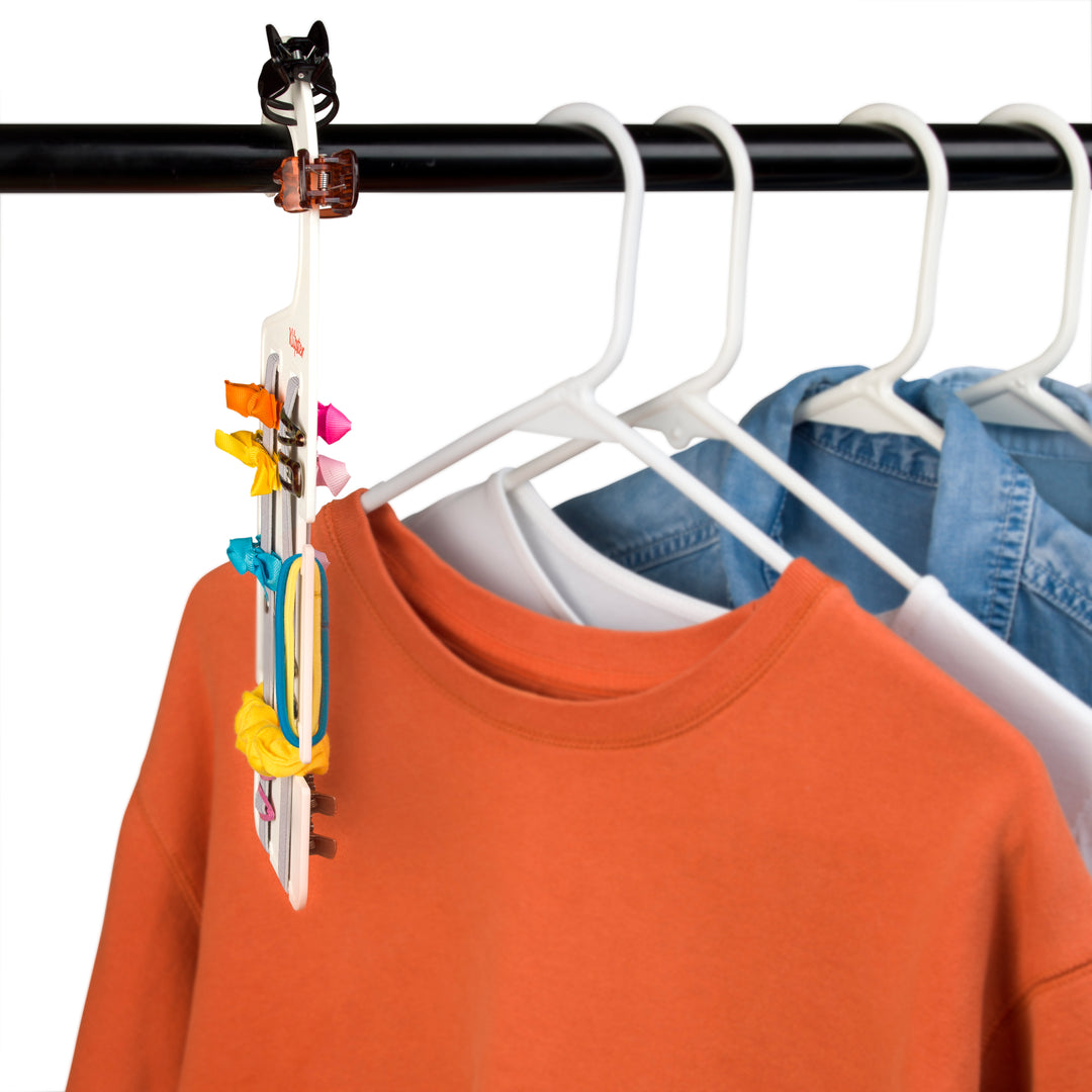 Classic Klipster hair accessories organizer with hanging hook. Compact, double-sided storage for clips, bows, scrunchies, ties, and more. Lightweight and travel-ready.