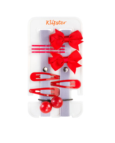 Red bows, clips, and hair ties on the Mini Klipster hair accessories organizer